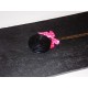 Collier bonbon réglisse rond avec petit nœud rose 